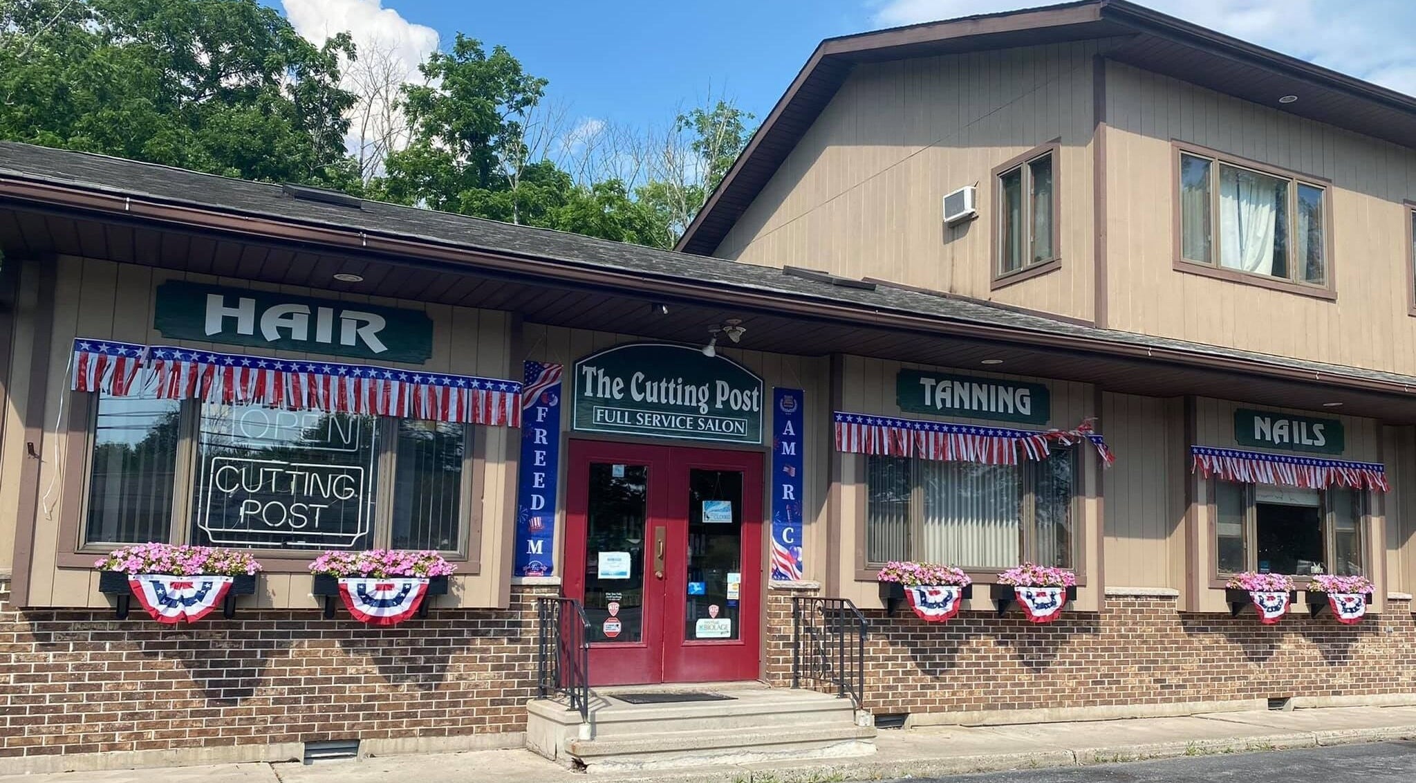 The Cutting Post hair, tanning, and nails salon in Tannersville, Pennsylvania, US with patriotic decorations.