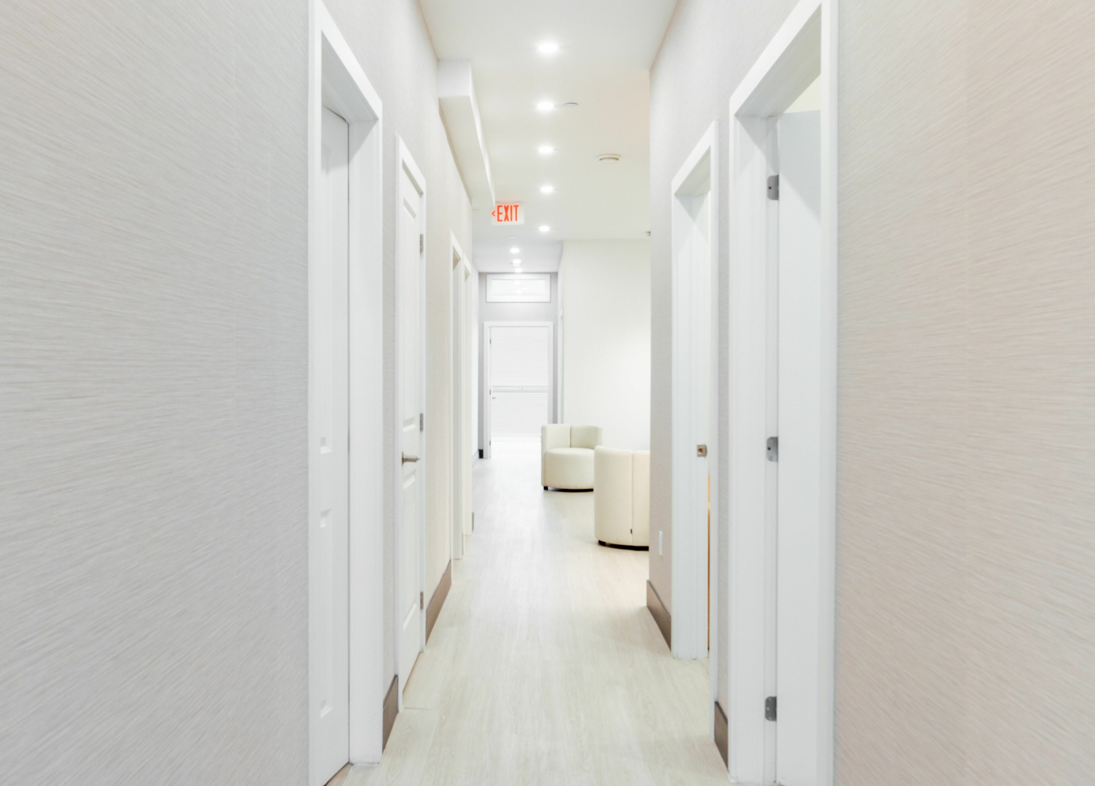 Bright hallway at MG Aesthetics in Vaughan, Ontario, CA, featuring modern design and soft lighting.