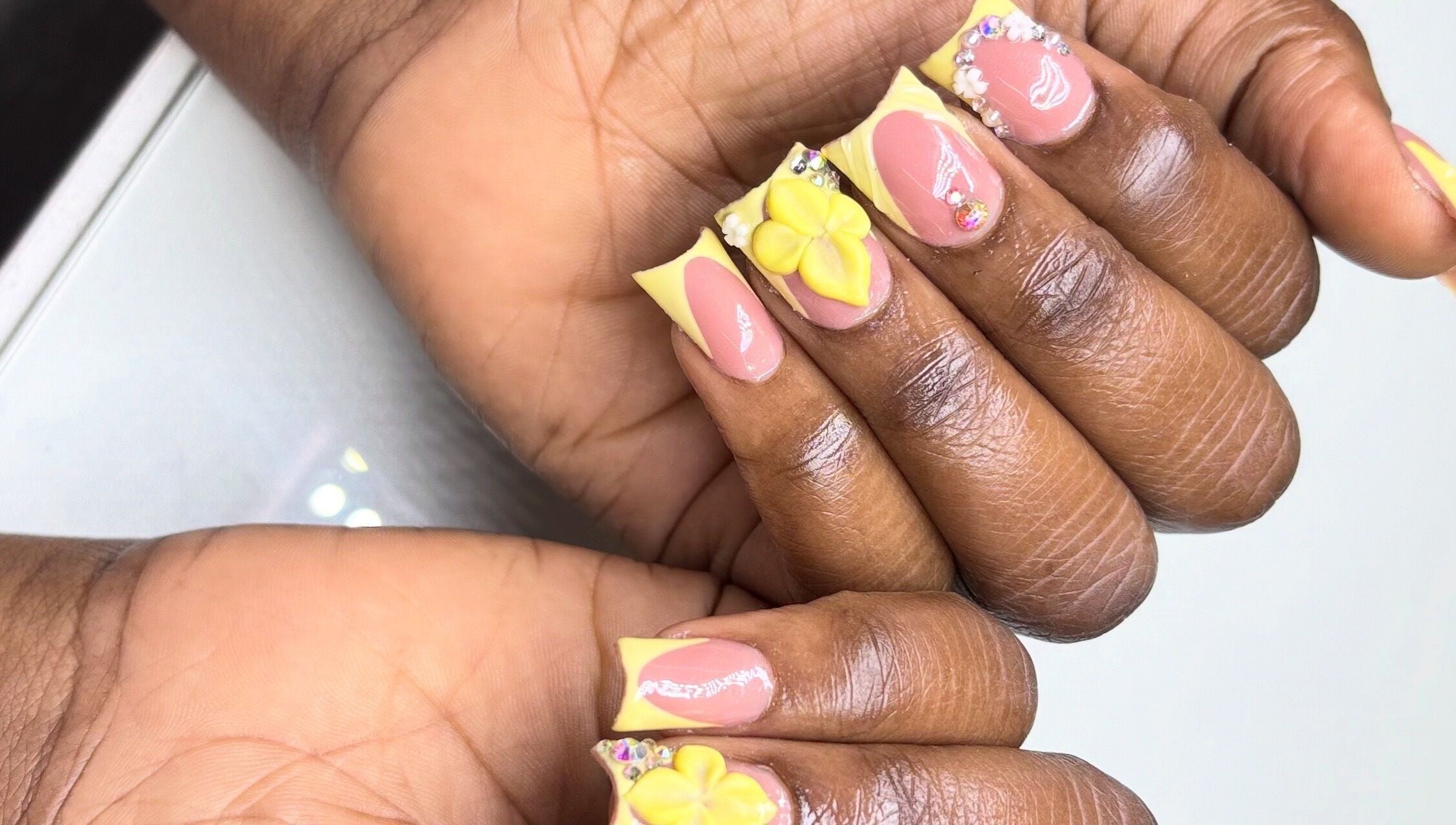 Detailed floral and gem nail art at Mimi's Nails, Port of Spain, Charlotte St, TT.