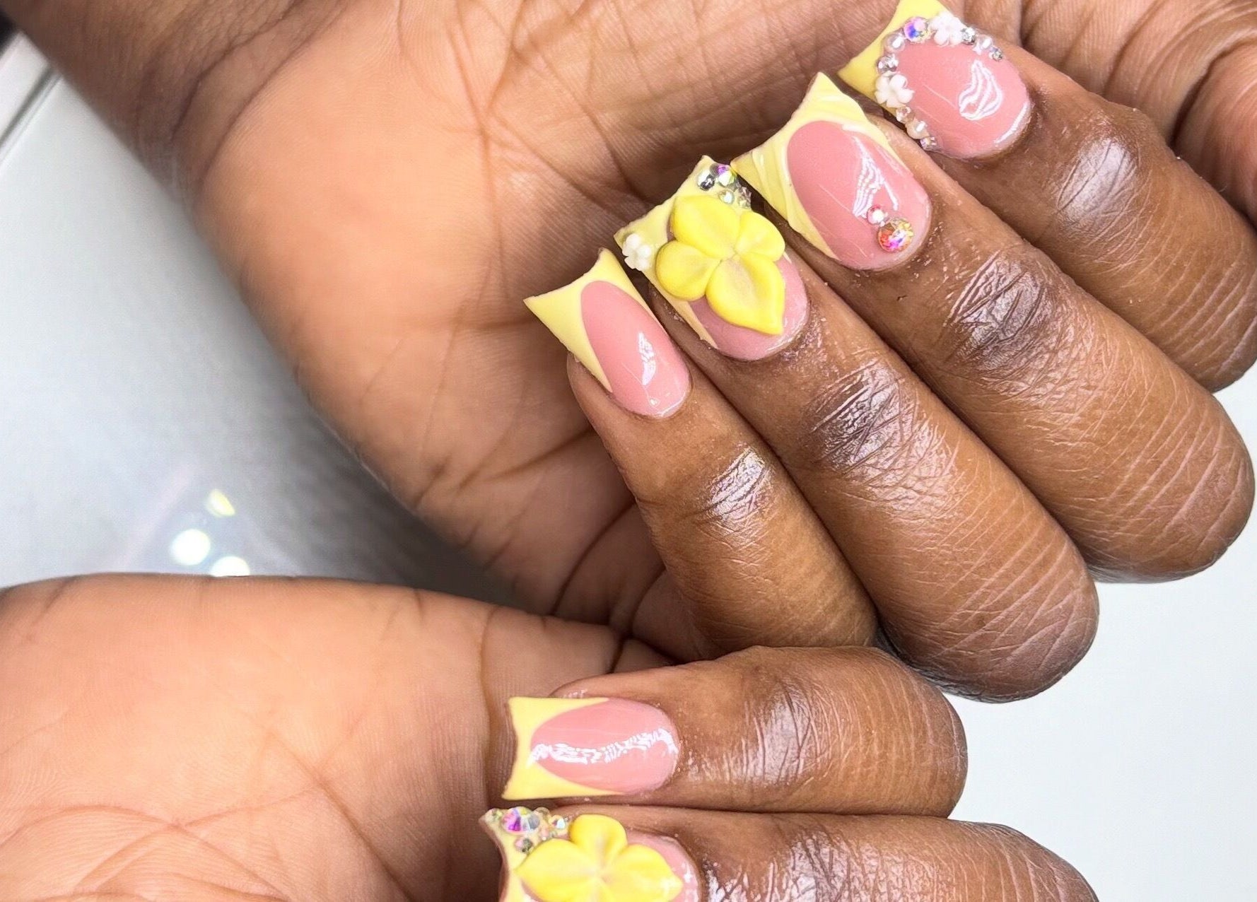 Detailed floral and gem nail art at Mimi's Nails, Port of Spain, Charlotte St, TT.