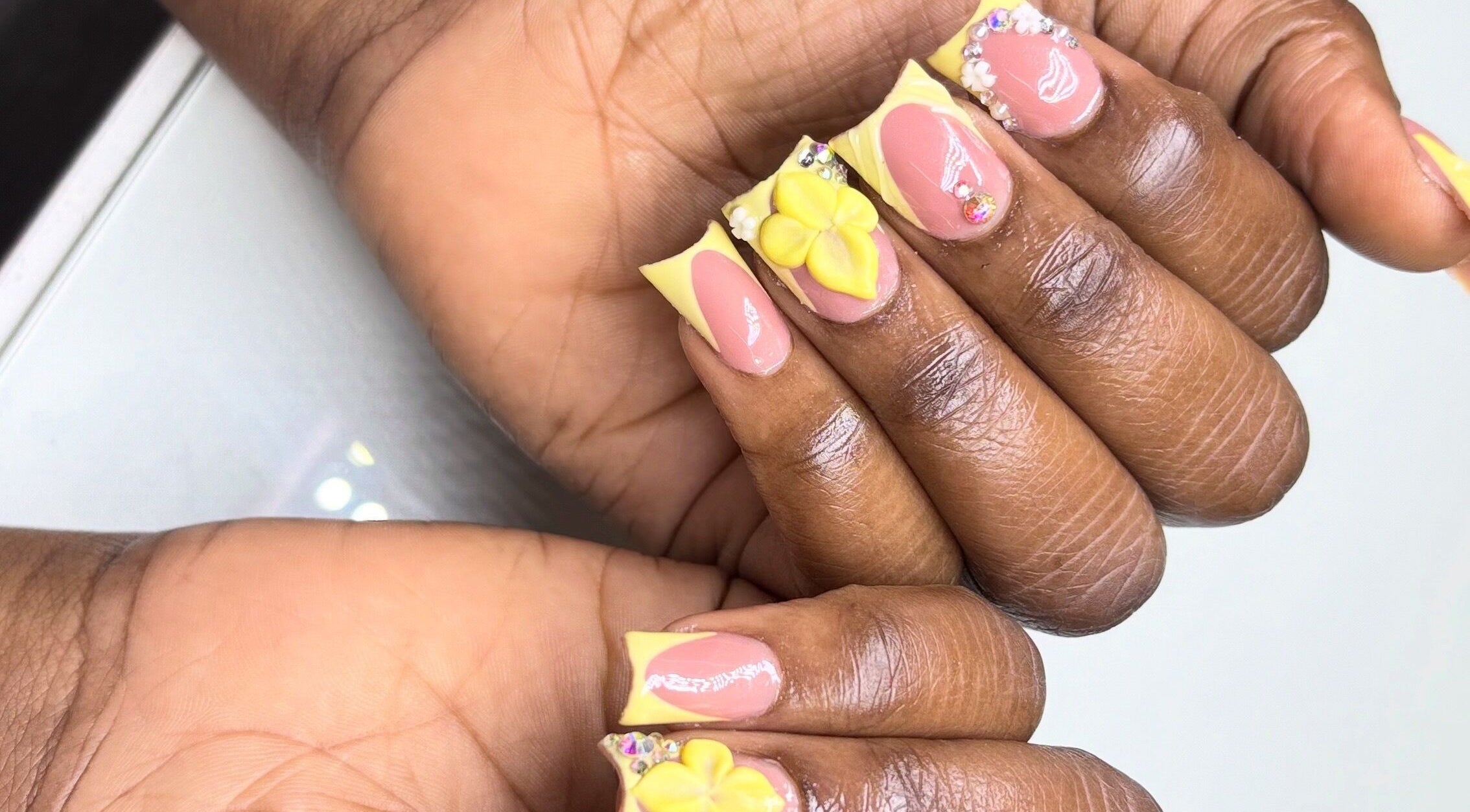 Detailed floral and gem nail art at Mimi's Nails, Port of Spain, Charlotte St, TT.