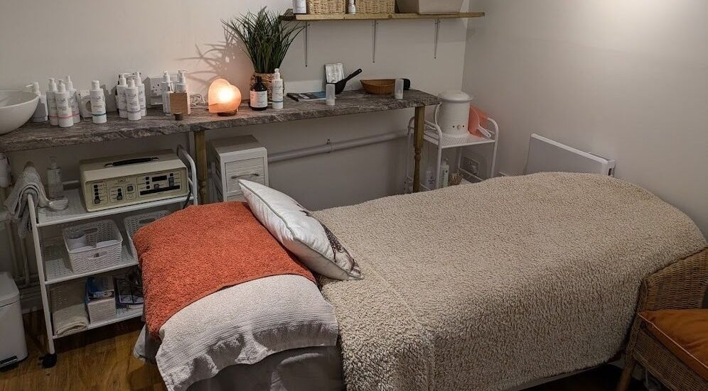 Tranquil treatment room at Nature's Temple Beauty, Sudbury, England, GB, featuring a cozy treatment bed and calming decor.