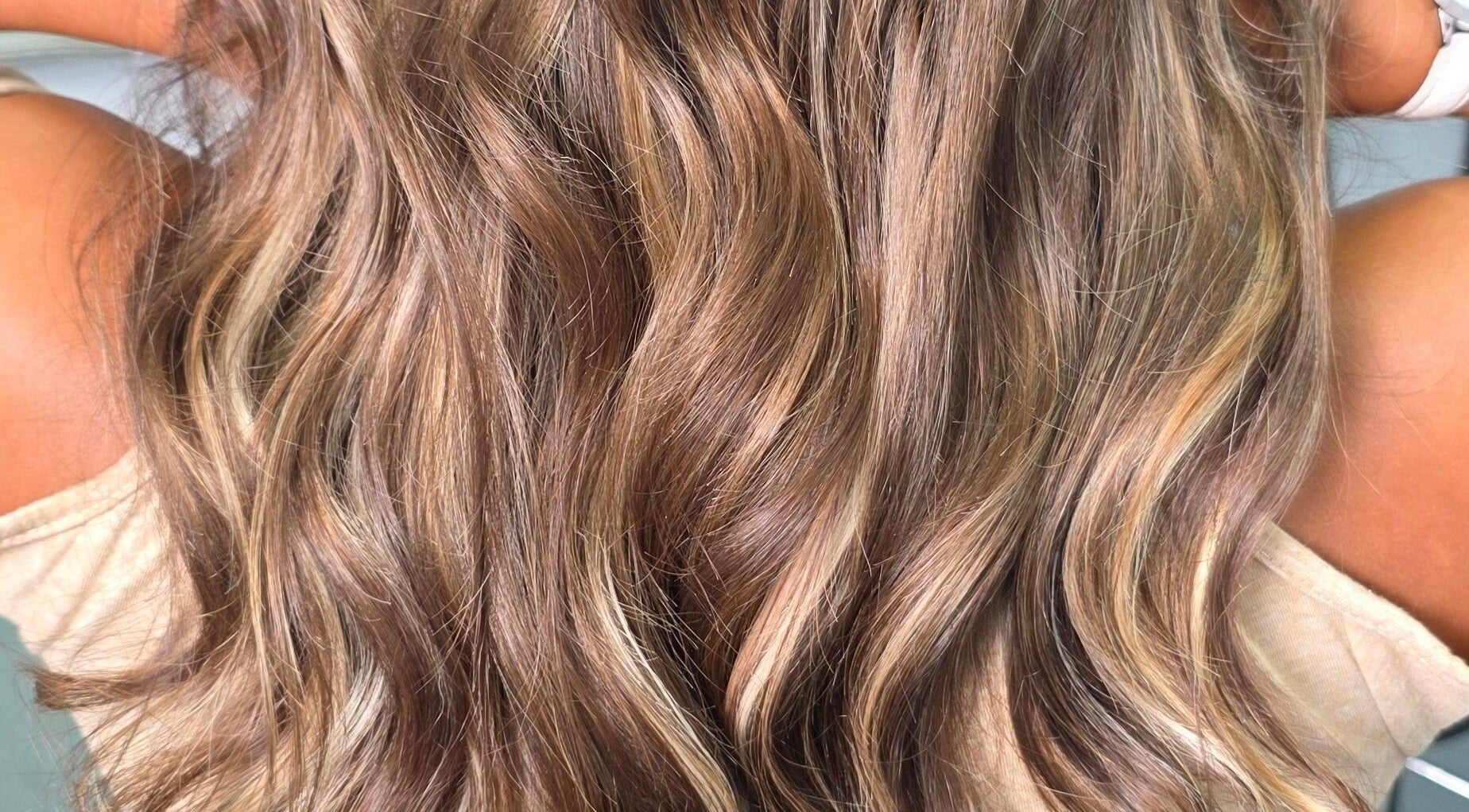 Close-up of lush, wavy hair styled at Kym Bongartz Hair in Edinburgh, Scotland, GB.