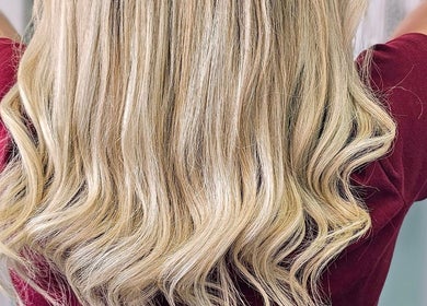 Stylish blonde hair in waves at Kym Bongartz Hair, Edinburgh, Scotland, GB.
