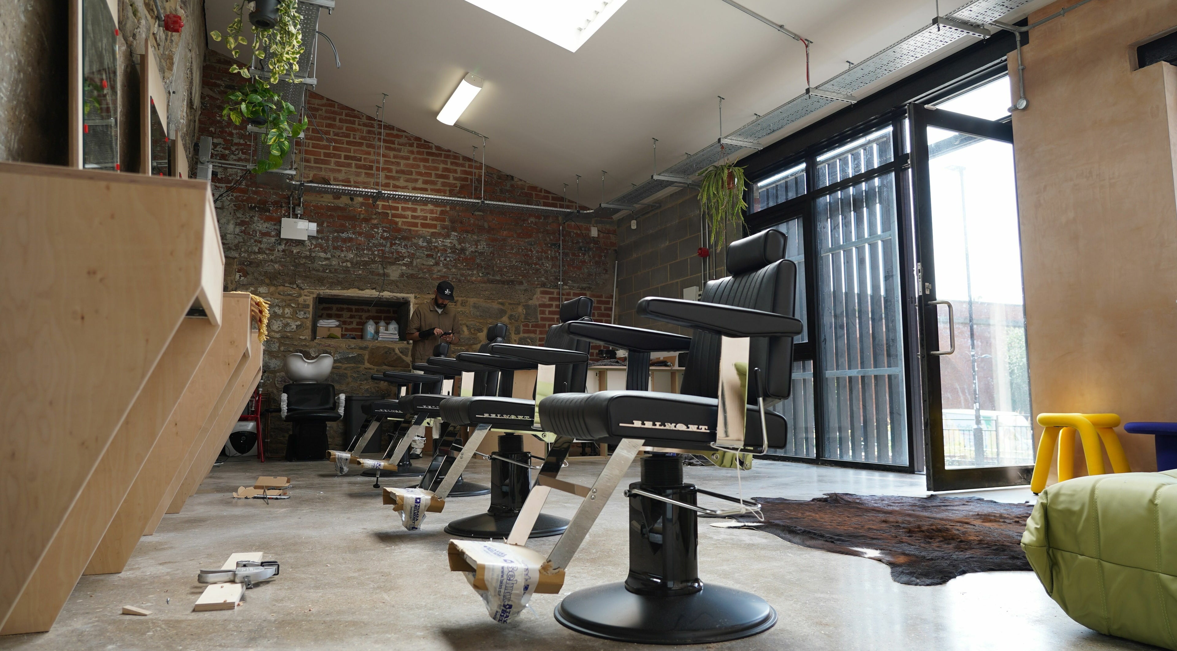 Modern barber chairs at The Hoi Polloi Ouseburn, Newcastle upon Tyne, England, GB, showcasing stylish interior.