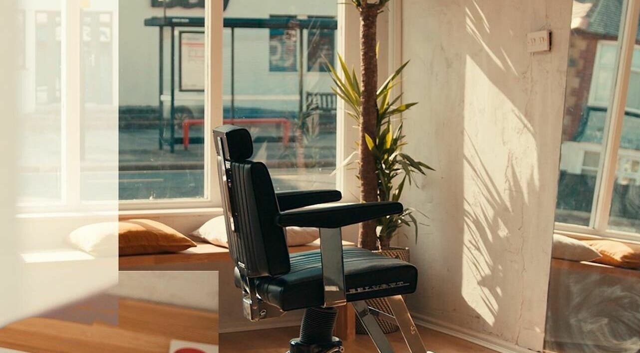 Stylish barber chair at The Hoi Polloi Whitley Bay, Whitley Bay, England, GB with natural lighting.