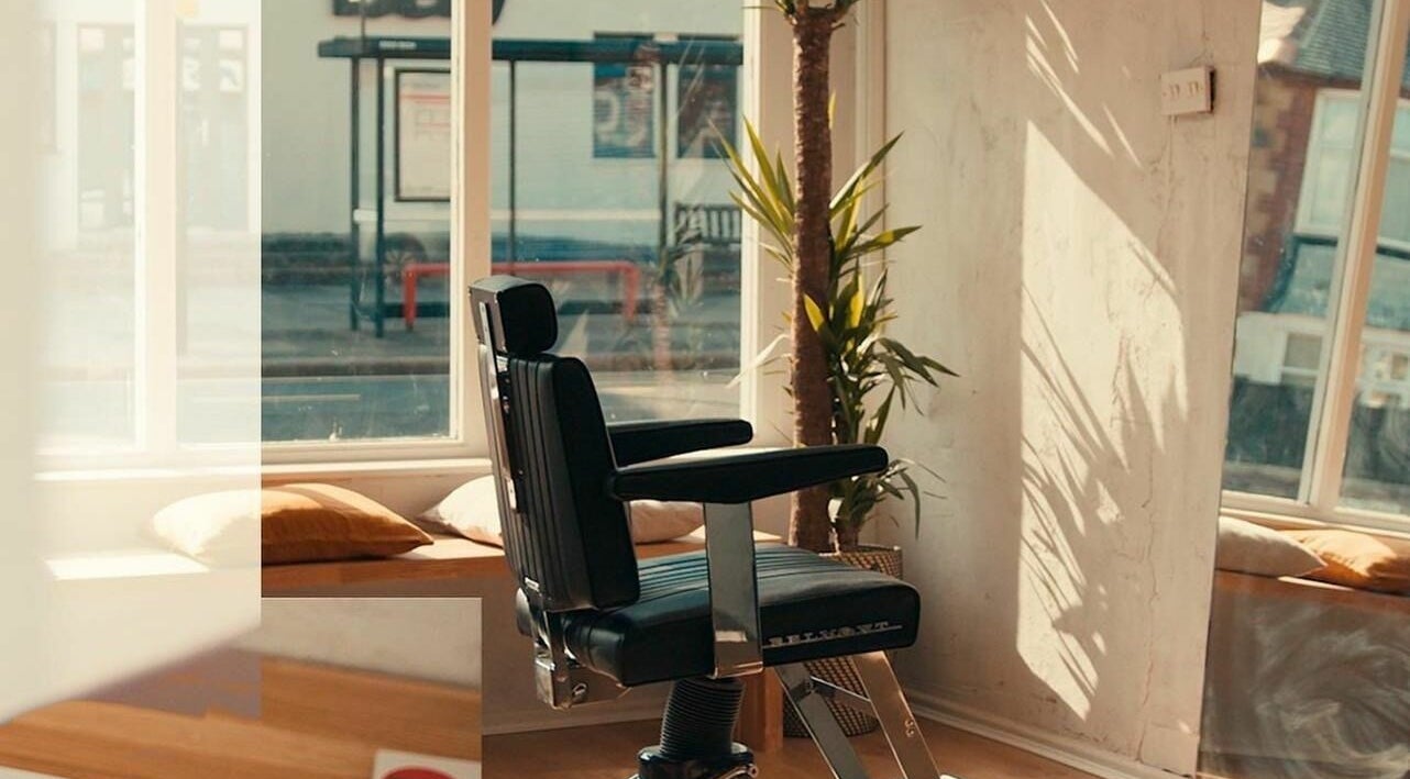 Stylish barber chair at The Hoi Polloi Whitley Bay, Whitley Bay, England, GB with natural lighting.