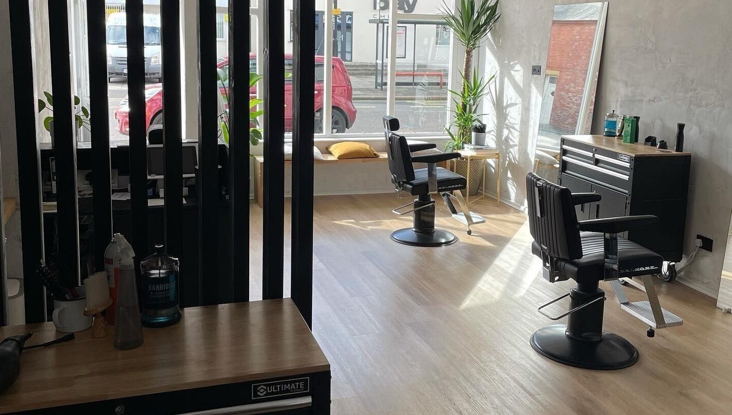 Modern salon interior at The Hoi Polloi City Centre, Newcastle upon Tyne, England, GB with stylish chairs and decor.
