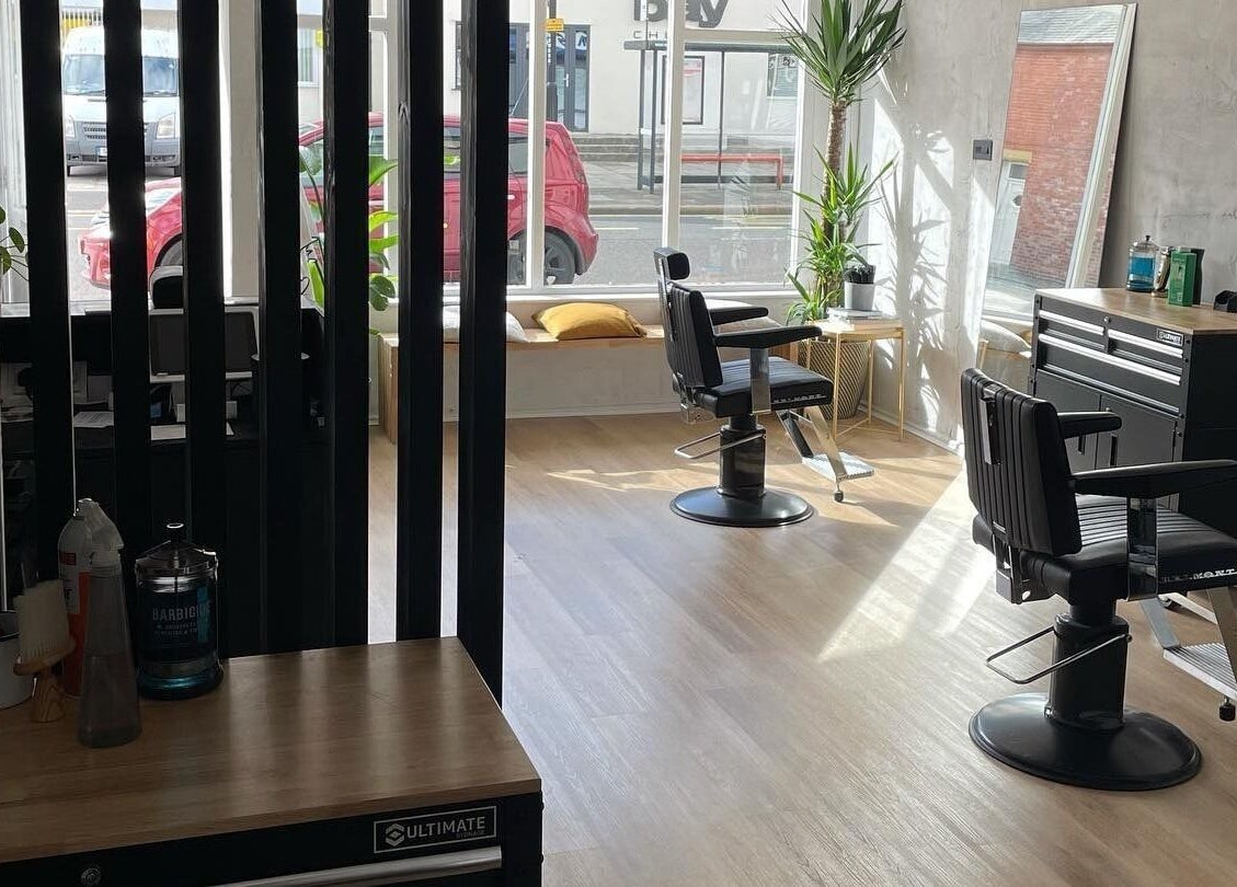 Modern salon interior at The Hoi Polloi City Centre, Newcastle upon Tyne, England, GB with stylish chairs and decor.