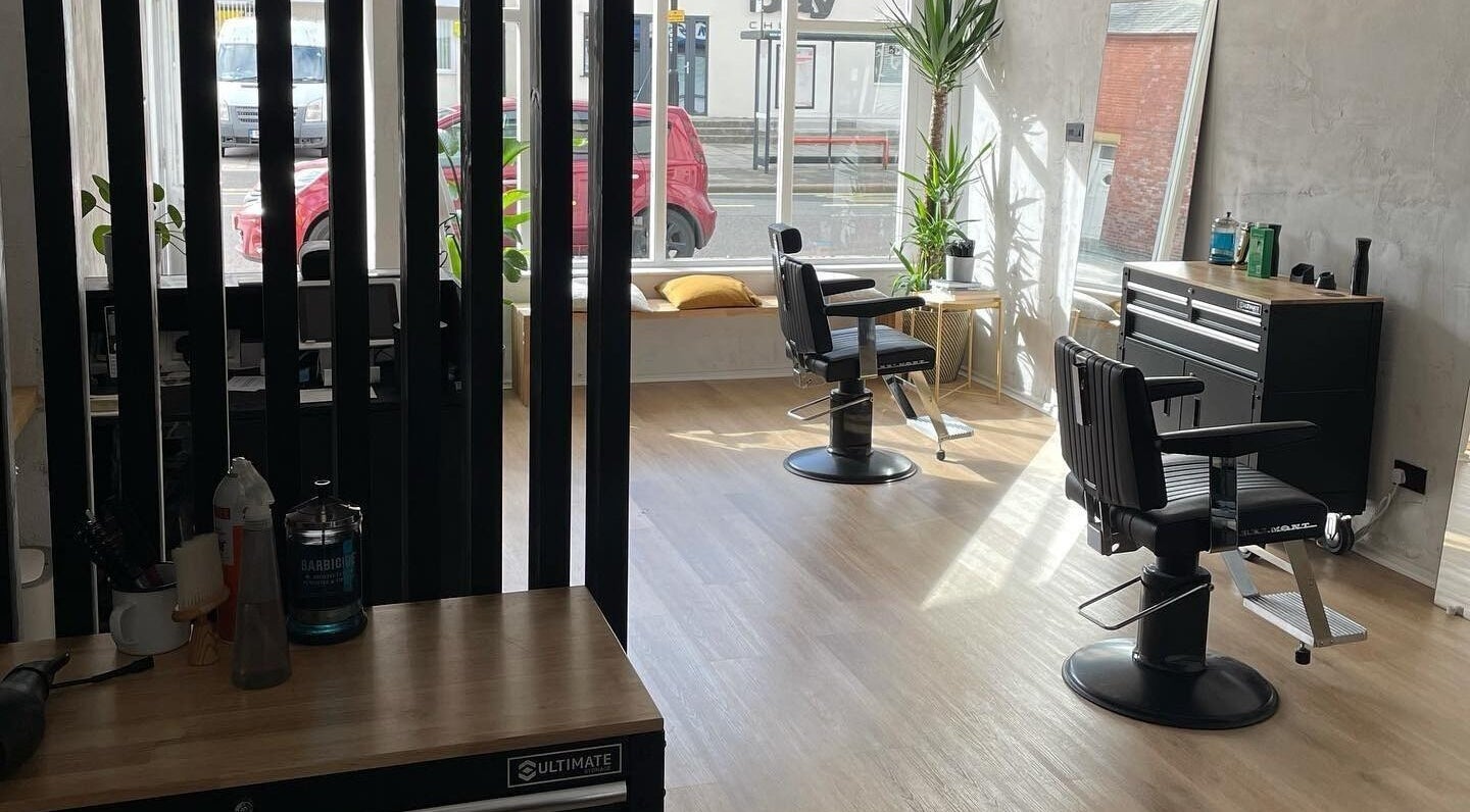 Modern salon interior at The Hoi Polloi City Centre, Newcastle upon Tyne, England, GB with stylish chairs and decor.