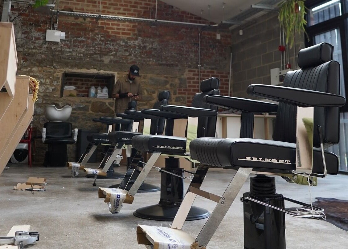 Stylish barber chairs lined up at The Hoi Polloi City Centre, Newcastle upon Tyne, England, GB.
