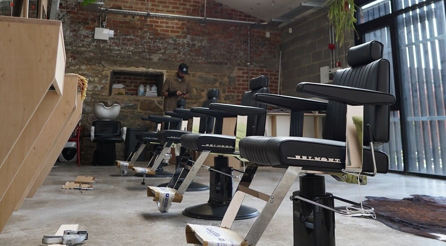 Stylish barber chairs lined up at The Hoi Polloi City Centre, Newcastle upon Tyne, England, GB.
