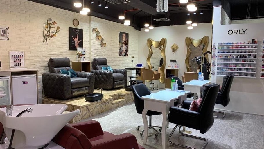 Luxurious seating area inside Elle Beauté Ladies Salon, Dubai, AE, showcasing elegant and modern decor.