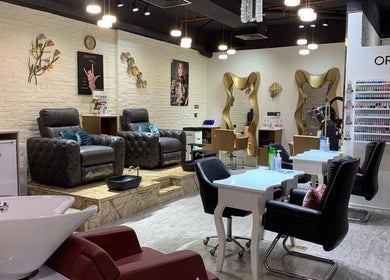 Luxurious seating area inside Elle Beauté Ladies Salon, Dubai, AE, showcasing elegant and modern decor.