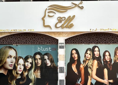 Front view of Elle Beauté Ladies Salon in Dubai, AE, featuring stylish salon entrance and fashion posters.