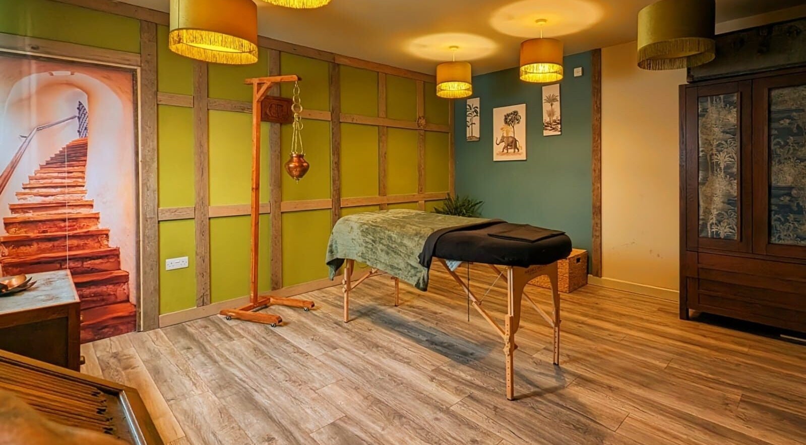 Therapeutic massage room at Natural Healing Haven, Therfield, England, offering a peaceful ambiance.