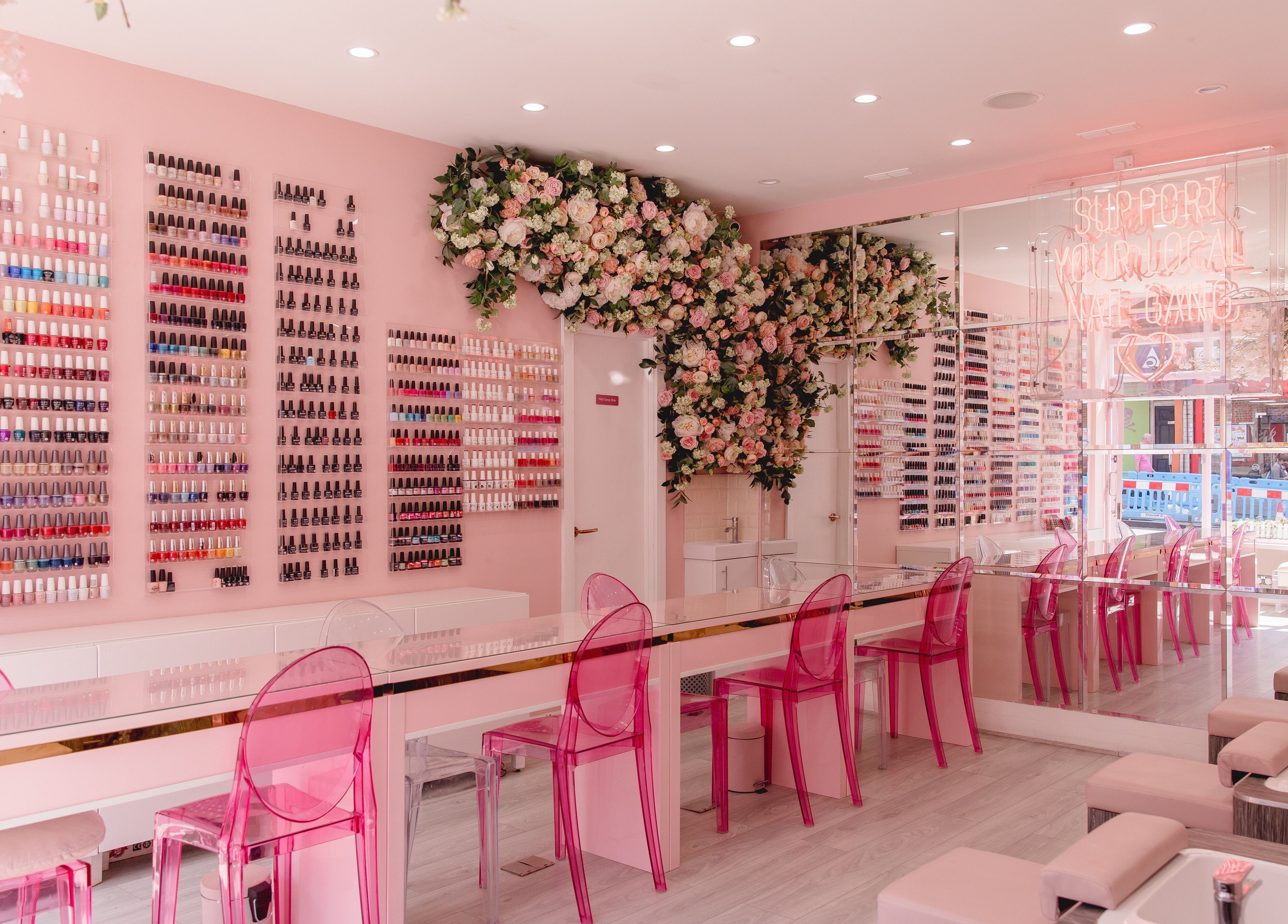 Nail'd It Clapham's vibrant nail polish wall and floral decor in London, England, GB.