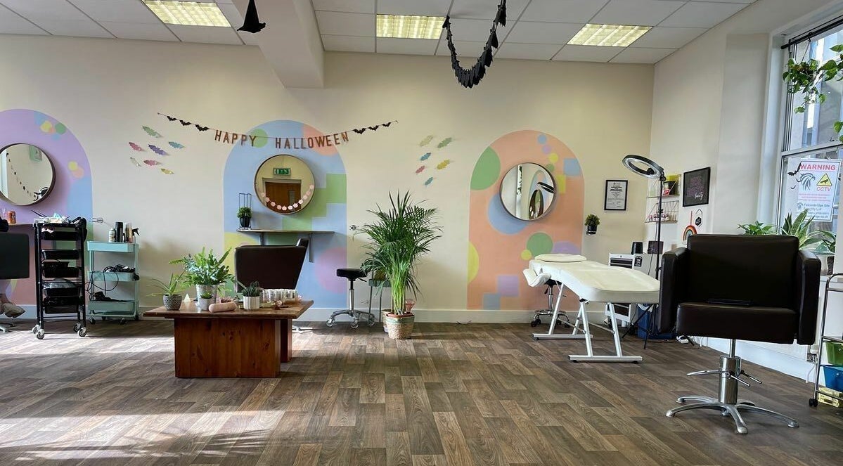 Modern interior of Hair by Leah Luchia, Leeds, England, GB, featuring stylish decor and comfortable salon chairs.