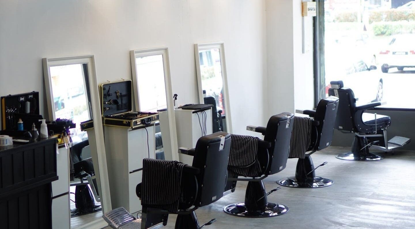 Interior view of Downsouth Barbershop Setia Tropika, Johor Bahru, Johor, MY, featuring stylish barber chairs.