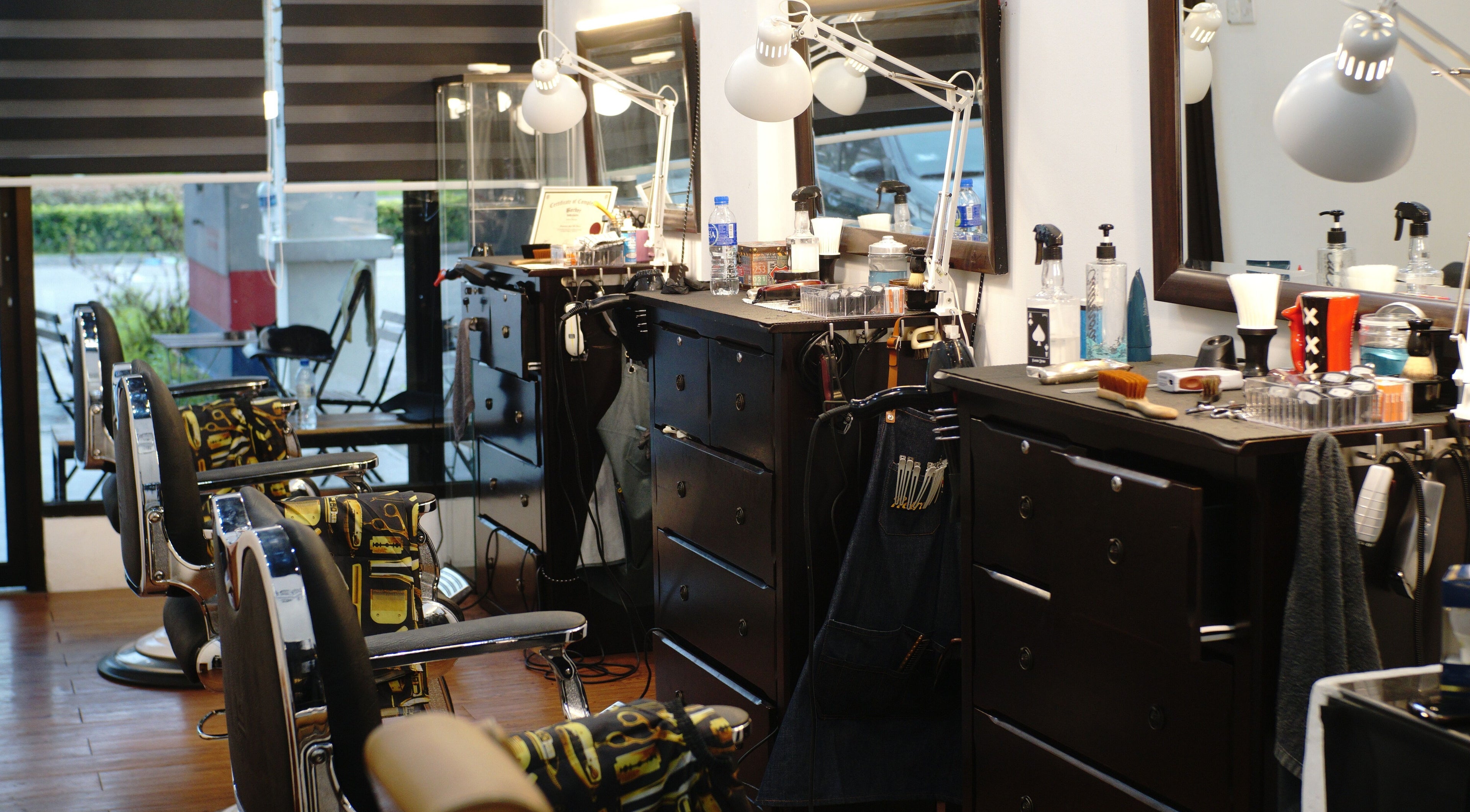 Interior of Downsouth Barbershop Setia Tropika in Johor Bahru, Johor, MY with modern barber chairs and equipment.