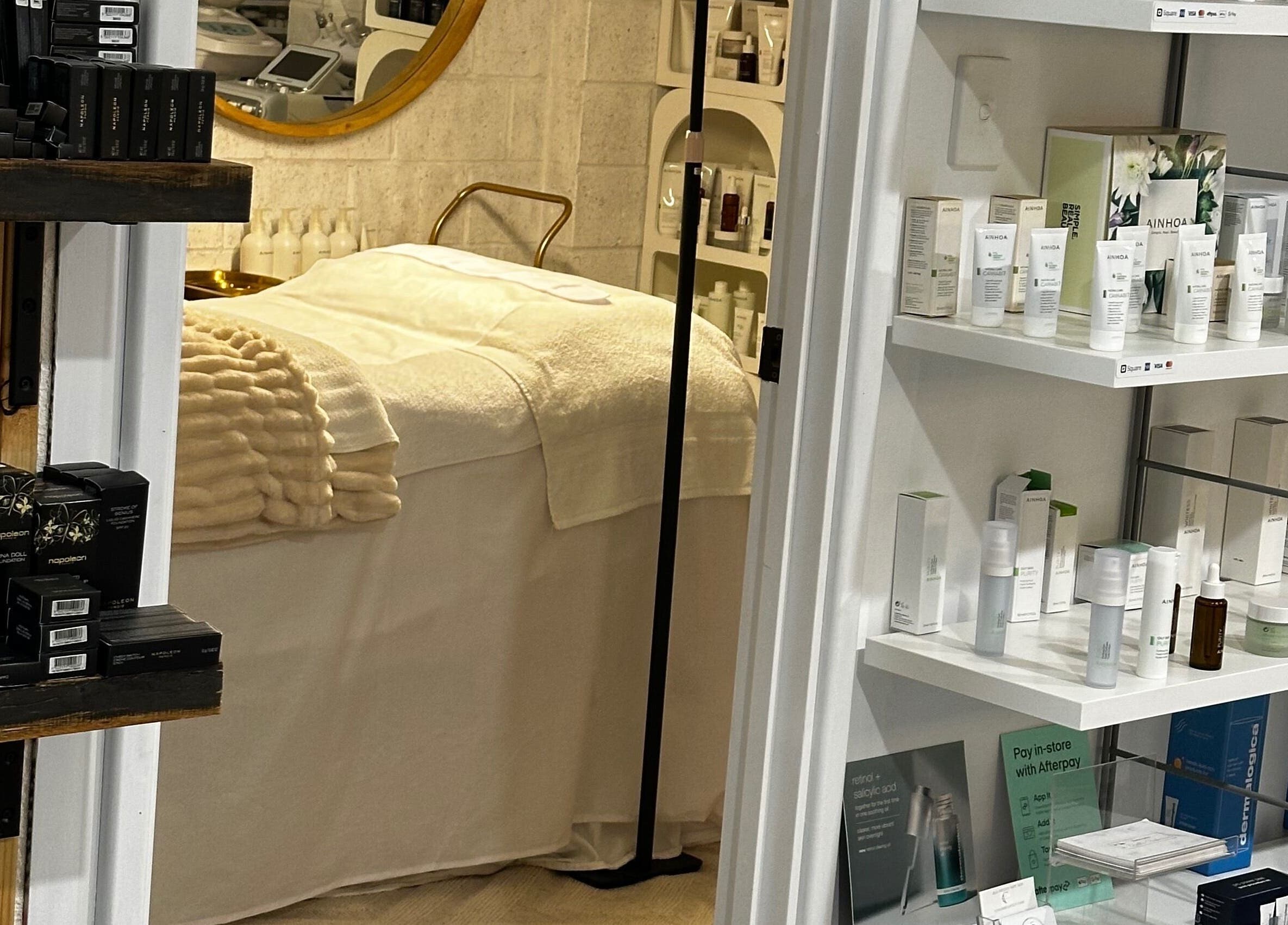 Relaxing treatment room at Bella Perfection Salon, Eglinton, Western Australia, AU, showcasing skincare products.