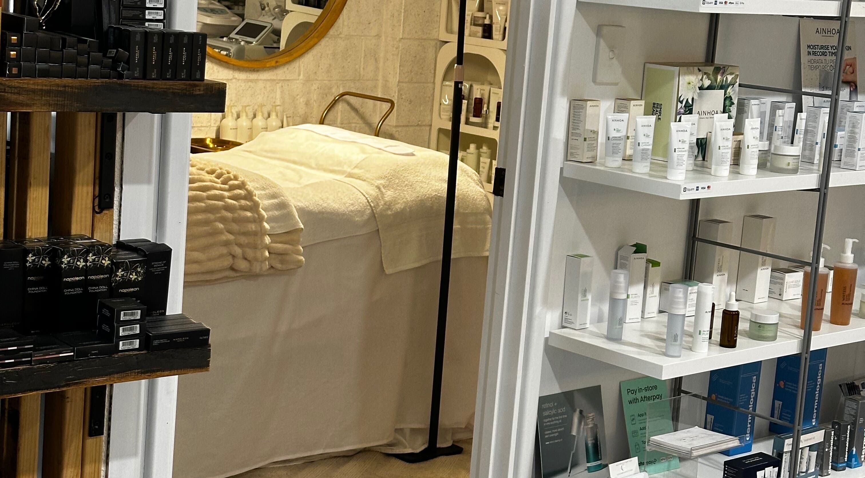 Relaxing treatment room at Bella Perfection Salon, Eglinton, Western Australia, AU, showcasing skincare products.