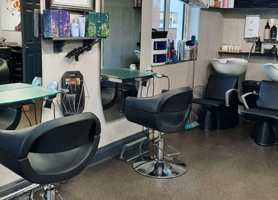 Modern interior of Carrigaline Organic Hair Studio, Carrigaline, County Cork, IE with stylish salon chairs and mirrors.