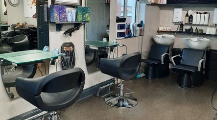 Modern interior of Carrigaline Organic Hair Studio, Carrigaline, County Cork, IE with stylish salon chairs and mirrors.