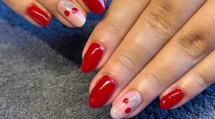 Red cherry nail design at Sara Eaves Beauty, Southend-on-Sea, England, GB. Perfect for vibrant looks.