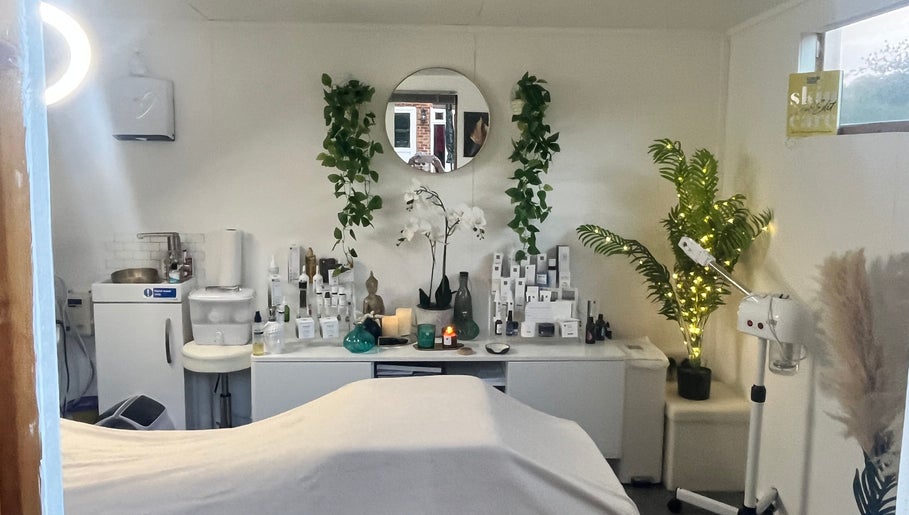 Relaxing treatment room at Precisions Skin Clinic, Leighton Buzzard, England, with serene decor and skincare products.