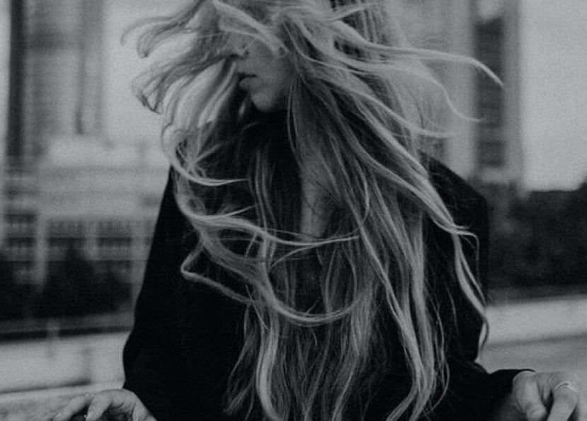 Wind-blown hair showcasing style at SO Natural Extensions, Epsom, England, GB.