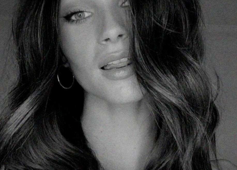 Elegant hairstyle showcasing luxurious waves at SO Natural Extensions, Epsom, England, GB.