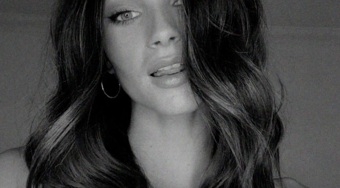 Elegant hairstyle showcasing luxurious waves at SO Natural Extensions, Epsom, England, GB.