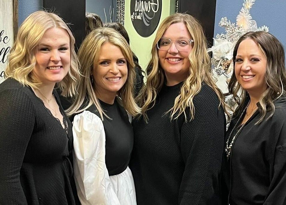 Stylists at Genesis Salon and Spa in Boscobel, Wisconsin, US, smiling together.