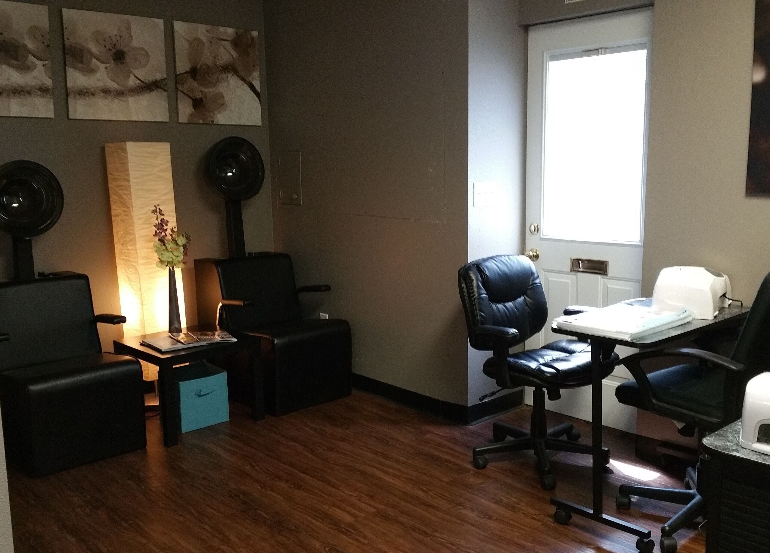 Elegant interior of Genesis Salon and Spa in Boscobel, Wisconsin, US featuring modern chairs and decor.