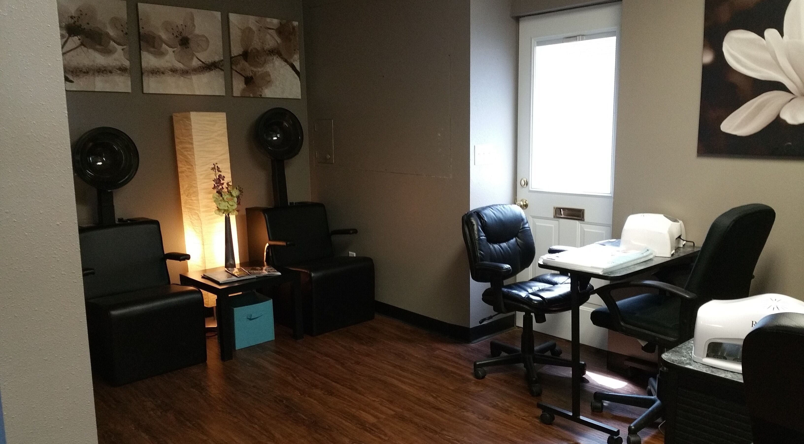 Elegant interior of Genesis Salon and Spa in Boscobel, Wisconsin, US featuring modern chairs and decor.
