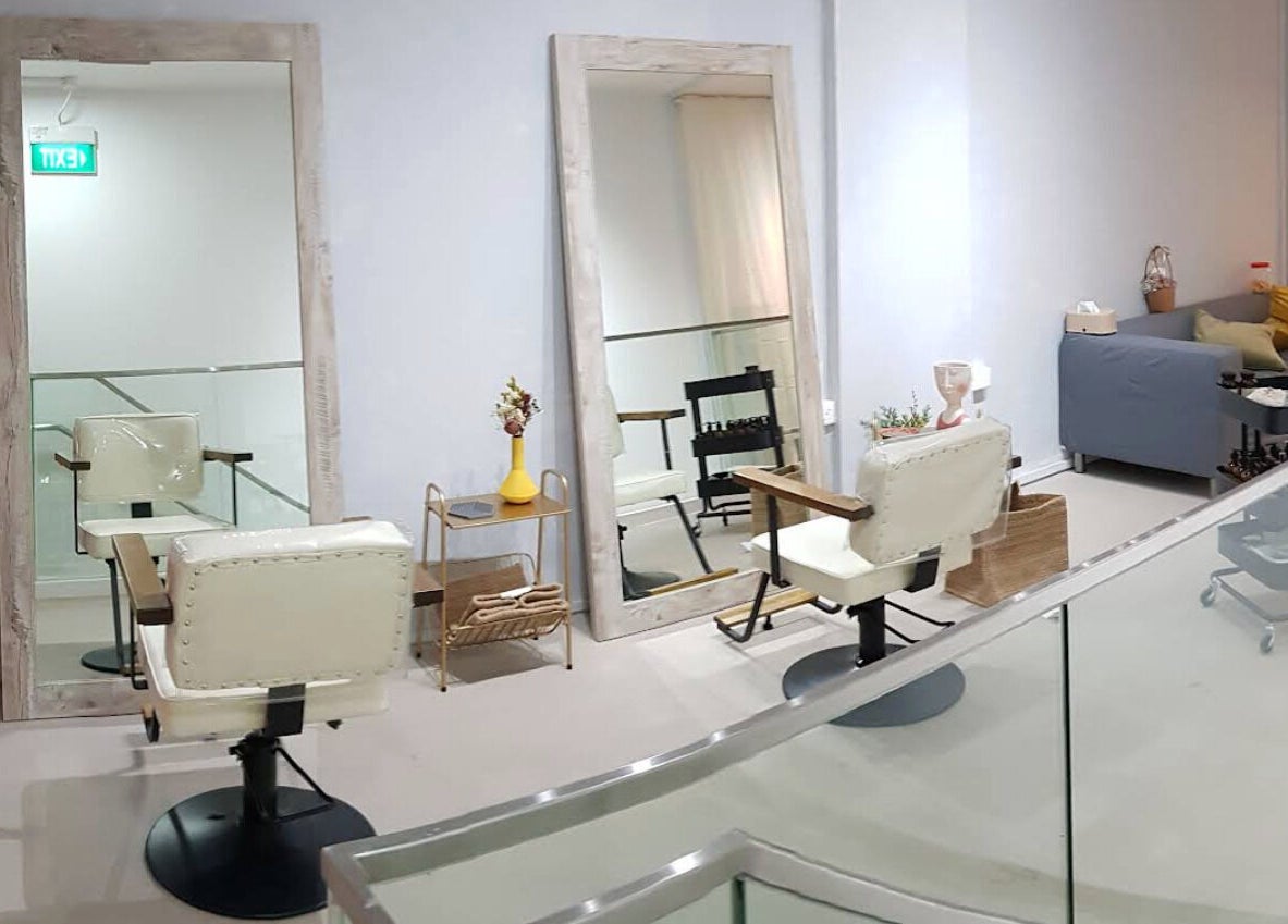 Elegant salon setup at Dogether, Singapore, SG featuring large mirrors and plush seating.