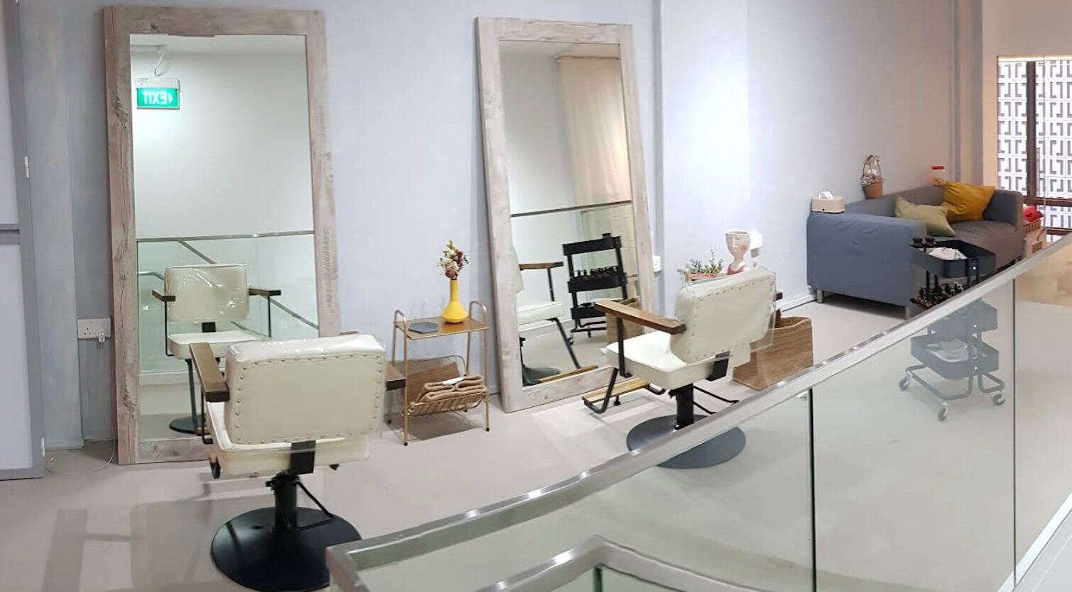 Elegant salon setup at Dogether, Singapore, SG featuring large mirrors and plush seating.