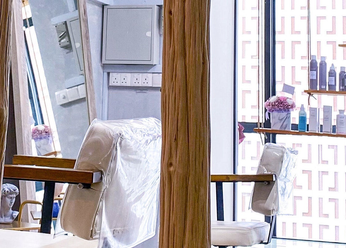 Elegant salon interior at Dogether, Singapore, SG with stylish chairs and product display.