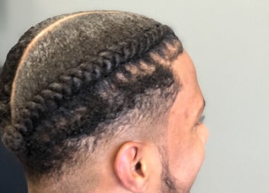 Close-up of stylish braided hairstyle at Pressed Unlimited in Jacksonville, Florida, US.