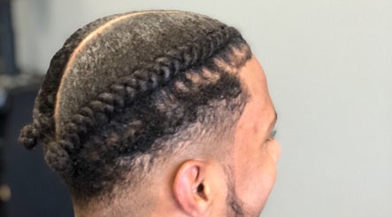 Close-up of stylish braided hairstyle at Pressed Unlimited in Jacksonville, Florida, US.