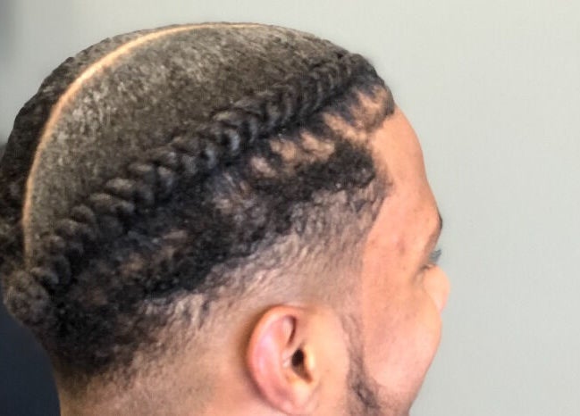 Elegant braided hairstyle at Pressed Unlimited in Jacksonville, Florida, US.