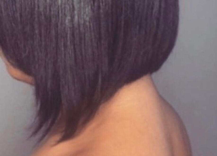 Elegant bob hairstyle at Pressed Unlimited in Jacksonville, Florida, US, showcasing precise cutting technique.