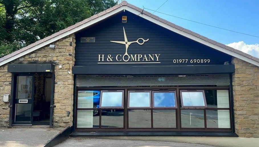 Exterior of H & Co beauty salon in Pontefract, England, GB with stylish signage and stone façade.