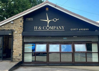 Exterior of H & Co beauty salon in Pontefract, England, GB with stylish signage and stone façade.