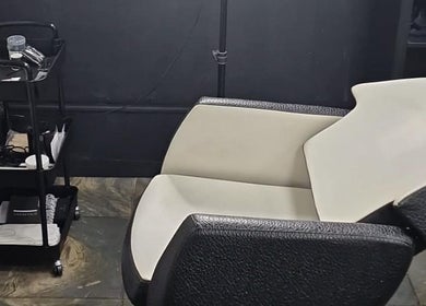 Comfortable salon chair and trolley at H & Co, Pontefract, England, GB, showcasing modern beauty service setup.