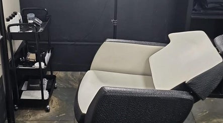 Comfortable salon chair and trolley at H & Co, Pontefract, England, GB, showcasing modern beauty service setup.