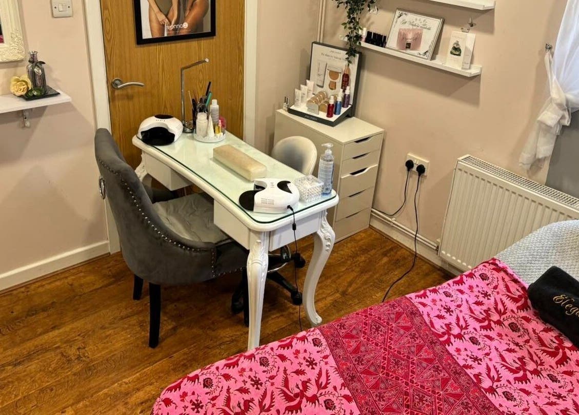 Elegance Beauty's inviting treatment room in Osmaston, England, GB, showcasing a stylish manicure setup and cozy decor.