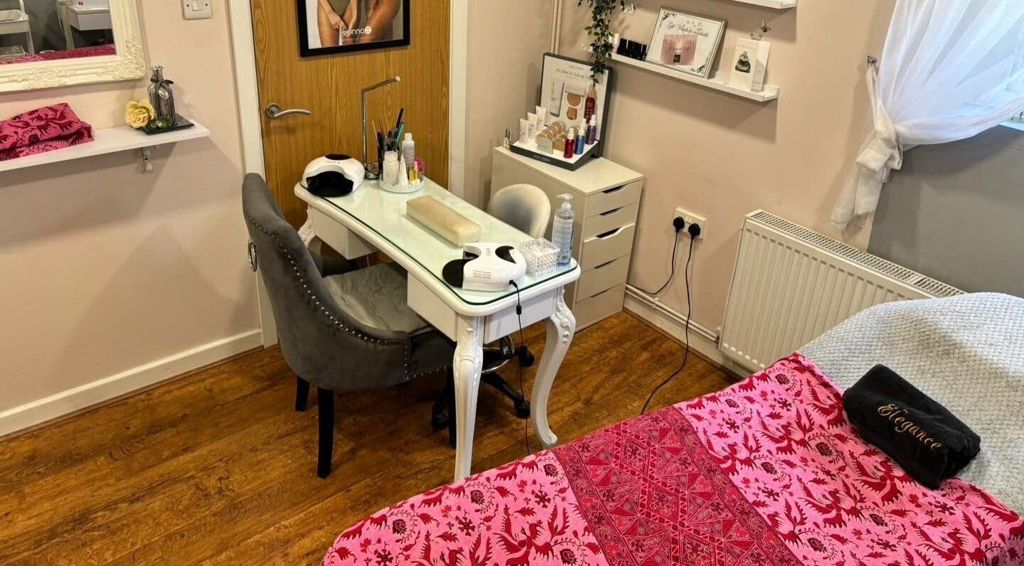 Elegance Beauty's inviting treatment room in Osmaston, England, GB, showcasing a stylish manicure setup and cozy decor.