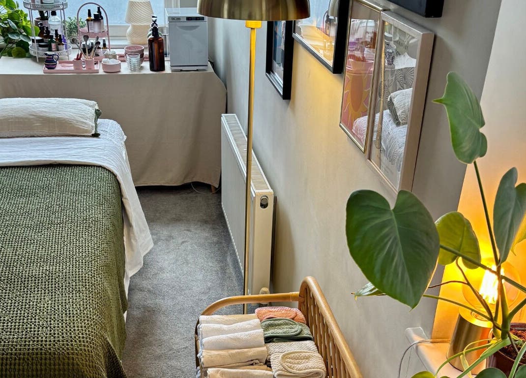 Cozy therapy room at Aceso Healing Therapies, Margate, England, GB with a neatly made bed and calming decor.